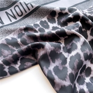 Luxurious leopard print silk square scarf with black and white striped border design