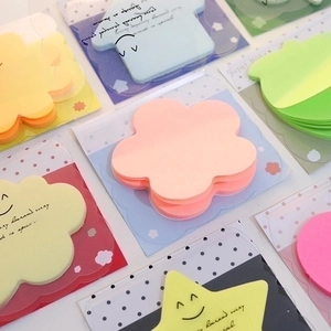 Fluorescent colorful sticky notes in star and flower shapes for creative journaling