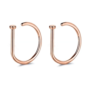 Pair of rose gold D-shaped nose rings with a smooth polished finish and flat disc ends