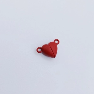 Close-up of red heart-shaped magnetic clasp connectors for DIY bracelet and jewelry making