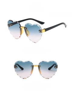 Detail view of heart-shaped rimless sunglasses for kids with gradient lenses and metal nose pads