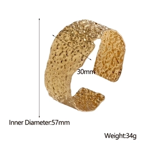 Detail showing 30mm wide 18K gold plated hammered cuff with 57mm inner diameter