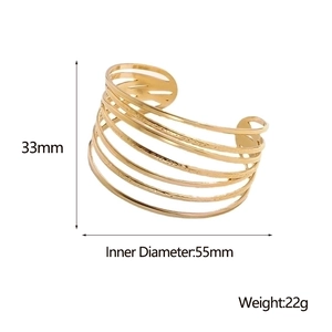 Detail showing 33mm height and 55mm diameter of the layered gold stainless steel cuff