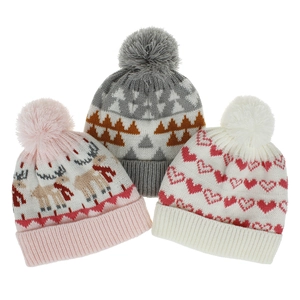 Close-up of knit hats with dinosaur jacquard and soft pom-poms in various patterns