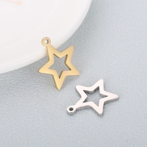 Detailed view of small star-shaped metal charms in gold and silver finish with holes