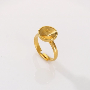 Macro view of adjustable gold stainless steel ring blank with a round bezel setting