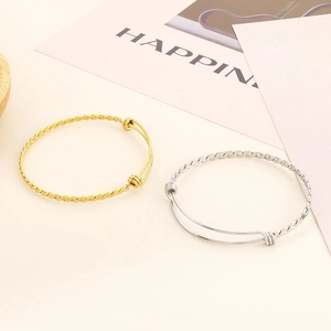 Adjustable twisted cable rope bracelet in polished gold and silver stainless steel