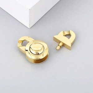 Detailed view of two gold stainless steel jewelry clasps for DIY chain accessories