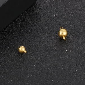 Detailed view of polished gold magnetic ball clasps for DIY jewelry necklaces and bracelets