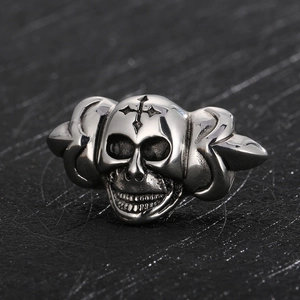Macro shot of a silver skull bead with wings, detailed punk accessory for leather cords