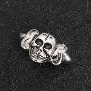 Macro detail of a punk-style silver skull metal charm for DIY leather jewelry design