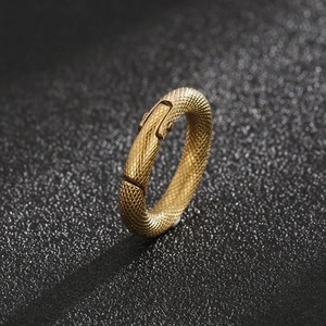 Polished gold stainless steel ring featuring detailed snake scale pattern on black surface