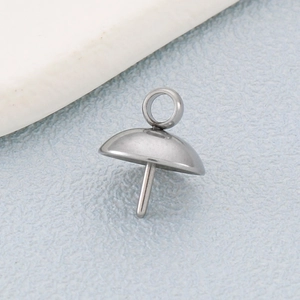 Macro detail of stainless steel pearl cup pendant connector for DIY jewelry making