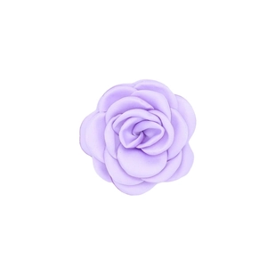 Detailed close-up of handmade purple satin camellia flower with layered fabric petals