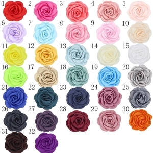 Handmade satin camellia flower accessories available in 32 vibrant colors for DIY projects