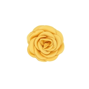 Detail showing the layered texture and bright yellow petals of the handmade satin camellia flower