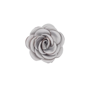 Detailed close-up of a handmade grey satin camellia flower for fashion accessories