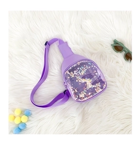 Detail of purple transparent chest bag featuring colorful star-shaped sequins and wide strap
