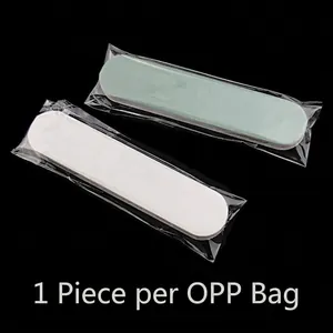 Detailed view of dual-sided nail buffer strip individually wrapped in clear OPP plastic bag