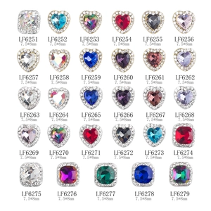 Various colorful 3D heart and square crystal nail art charms in a neat grid display