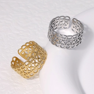 Detail view of gold and silver hollow lace pattern stainless steel adjustable open rings