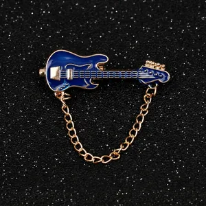 Mini electric guitar brooch in dark blue enamel with gold chain and metal trim