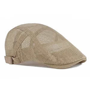 Breathable beige mesh beret cap for kids featuring side adjustable buckles on white background