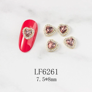Close-up of pink heart-shaped crystal nail charms with model LF6261 and 7.5x8mm size