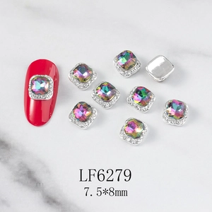 Macro view of iridescent 7.5x8mm square nail art rhinestones with silver metal base