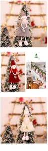Detail of plush Christmas angel ornaments with wings and sequins for holiday tree decor