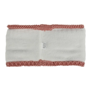 Detailed view of pink knitted headband featuring soft white fleece lining and material label