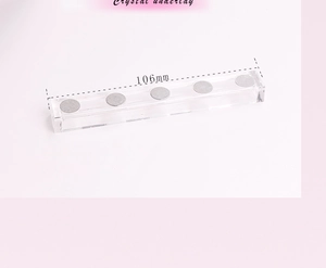 Macro view of 106mm long clear acrylic nail display base with five magnetic mounting points