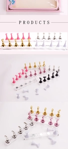Detail view of colorful magnetic nail art display stands on clear acrylic bases