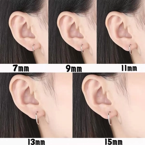 Size comparison showing 7mm to 15mm sterling silver hoop earrings worn on the ear