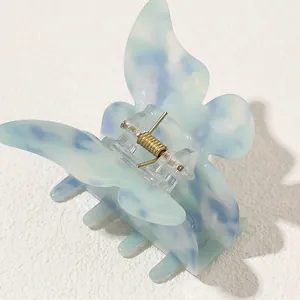 Ethereal butterfly hair claw clip with blue and white marble acetate finish