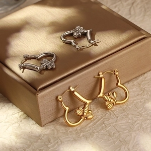 Minimalist heart-shaped hoop earrings with bee charm in gold and silver stainless steel