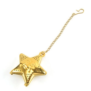 Star shaped golden stainless steel tea infuser with mesh holes and a smiley face design