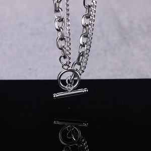 Modern double-layer stainless steel chain bracelet with OT toggle clasp on black surface