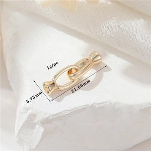Detail view of 14K gold plated necklace clasp with specific size and weight dimensions