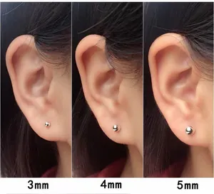 Detailed size comparison of 3mm, 4mm, and 5mm S999 silver ball stud earrings on the ear