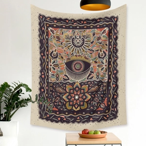 Detailed view of bohemian tapestry featuring mystic eye and mandala flower patterns