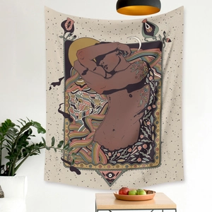 Detail of bohemian tapestry featuring a floral tattoo male portrait with sun and moon art