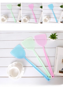 Detailed view of lightweight plastic fly swatters in pastel green, pink, and blue colors