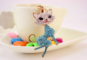 Detailed macro view of crystal fox keychain with blue rhinestones and gold lobster clasp