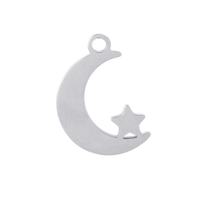 Detail shot of a silver moon and star pendant in a sleek minimalist jewelry design