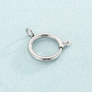 Macro detail of polished silver stainless steel spring ring clasp for jewelry making