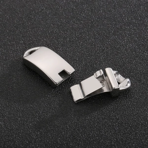Detailed macro view of silver stainless steel snap clasp for jewelry bracelet connection