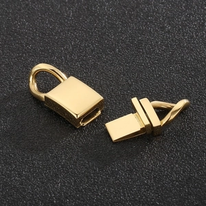 Detailed view of glossy gold titanium steel buckle clasp for stylish bracelets