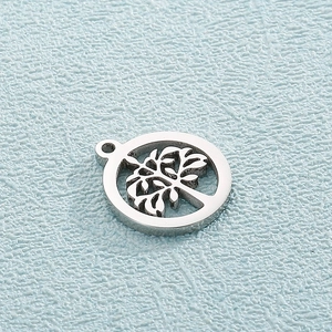 Macro shot of silver stainless steel round tree of life hollow charm with top ring