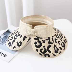 Women's leopard print open top straw sun hat with bow detail and adjustable wide brim